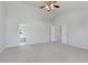 Bright bedroom featuring neutral carpet, vaulted ceilings, and entry to the ensuite bath at 4150 Huntsman Dr, Zionsville, IN 46077