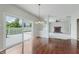 Dining area with vaulted ceilings, sliding glass doors to the deck, and hardwood floors at 4150 Huntsman Dr, Zionsville, IN 46077