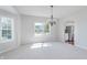 Open-concept dining room leads to a well-equipped kitchen at 4150 Huntsman Dr, Zionsville, IN 46077