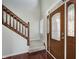 Welcoming foyer with hardwood floors, a staircase with wooden banister, and a decorative front door at 4150 Huntsman Dr, Zionsville, IN 46077