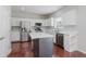 Modern kitchen featuring stainless steel appliances, white cabinets, and a center island at 4150 Huntsman Dr, Zionsville, IN 46077