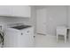 Laundry room with utility sink, cabinets, and white washer at 4150 Huntsman Dr, Zionsville, IN 46077