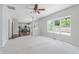 Spacious living room with carpet and a view of the kitchen, dining area, and deck at 4150 Huntsman Dr, Zionsville, IN 46077