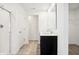 Modern bathroom with double sinks, quartz countertops, tile floors, and a glass-enclosed shower at 430 Louisiana Dr, Pittsboro, IN 46167