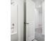 Bright bathroom with white tile, a bathtub/shower combo, and modern fixtures at 430 Louisiana Dr, Pittsboro, IN 46167