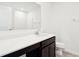 Modern bathroom with white countertops, dark cabinets, and a bright, clean design at 430 Louisiana Dr, Pittsboro, IN 46167