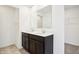 Contemporary bathroom featuring a double sink vanity with dark wood cabinets and modern lighting at 430 Louisiana Dr, Pittsboro, IN 46167