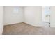 Inviting bedroom with neutral carpet, white walls, and a window providing natural light at 430 Louisiana Dr, Pittsboro, IN 46167