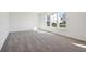 Sunny bedroom with neutral carpet and windows looking out to the yard at 430 Louisiana Dr, Pittsboro, IN 46167