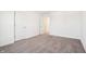 Spacious bedroom with neutral carpeting and ample natural light from doorway at 430 Louisiana Dr, Pittsboro, IN 46167