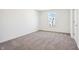 Cozy bedroom featuring plush carpet, a bright window, and neutral-toned walls at 430 Louisiana Dr, Pittsboro, IN 46167