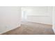 Neutral hallway with a carpet runner, white trim, leading to other areas of the home at 430 Louisiana Dr, Pittsboro, IN 46167