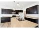 Spacious kitchen with granite countertops, stainless steel appliances and dark cabinets at 430 Louisiana Dr, Pittsboro, IN 46167