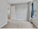 Bedroom featuring neutral carpet, natural light, and classic design; a cozy and functional living space at 5541 Lippan Way, Indianapolis, IN 46221