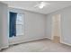 Bedroom with neutral carpet, ample natural light, closet, and simple design; comfortable and functional at 5541 Lippan Way, Indianapolis, IN 46221