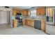 Functional kitchen featuring stainless steel appliances, tile floors, and ample counter space at 5541 Lippan Way, Indianapolis, IN 46221