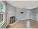Spacious living room boasts a fireplace, large windows, and an area ready for wall mounted TV at 5541 Lippan Way, Indianapolis, IN 46221