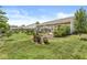 Sprawling backyard featuring a grill area, trees, and lush landscaping at 5865 Pennekamp Dr, Plainfield, IN 46168