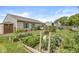 Backyard featuring raised garden beds, green lawn, and established landscaping at 5865 Pennekamp Dr, Plainfield, IN 46168