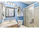 Bathroom featuring a framed mirror, shower, and toilet at 5865 Pennekamp Dr, Plainfield, IN 46168