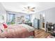 Bedroom with hardwood floors, large windows with natural light and walk in bathroom at 5865 Pennekamp Dr, Plainfield, IN 46168
