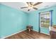 Bedroom with hardwood floors, a ceiling fan, and a window with lots of natural light at 5865 Pennekamp Dr, Plainfield, IN 46168