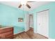 Bedroom showcasing hardwood floors, a closet, and blue walls at 5865 Pennekamp Dr, Plainfield, IN 46168
