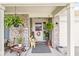 Charming front porch with brick accents and decoratively adorned entrance at 5865 Pennekamp Dr, Plainfield, IN 46168