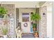 Inviting front porch decorated with ferns, a bench, and a 'Welcome' sign at 5865 Pennekamp Dr, Plainfield, IN 46168