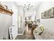 Inviting entryway with decorative accents, tile flooring, and stylish chandelier at 5865 Pennekamp Dr, Plainfield, IN 46168