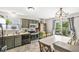 Eat in kitchen featuring stainless steel appliances, ample cabinet space, and access to the backyard at 5865 Pennekamp Dr, Plainfield, IN 46168