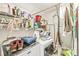 Organized laundry room featuring shelves, washer, dryer, and other laundry related items at 5865 Pennekamp Dr, Plainfield, IN 46168