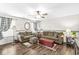 Cozy living room featuring hardwood floors, comfortable seating, and abundant natural light at 5865 Pennekamp Dr, Plainfield, IN 46168