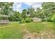 A view of the backyard of a home with a shed and a detached garage at 6349 S Harding St, Indianapolis, IN 46217