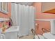 Functional bathroom with a standard sink, toilet, and shower at 6349 S Harding St, Indianapolis, IN 46217