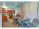 Eat-in kitchen and dining area with tile flooring and natural light at 6349 S Harding St, Indianapolis, IN 46217