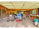 Spacious garage with lawnmowers and ample storage areas, great for equipment at 6349 S Harding St, Indianapolis, IN 46217