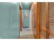 Hallway with doors leading to various rooms, showcasing neutral carpet at 6349 S Harding St, Indianapolis, IN 46217