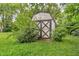 Weathered outdoor storage shed for lawn equipment at 6349 S Harding St, Indianapolis, IN 46217
