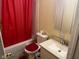 Small bathroom featuring a red shower curtain and a matching red rug at 8256 Meadowlark Dr, Indianapolis, IN 46226