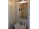 Powder room showcasing a pedestal sink and wall mirror at 8256 Meadowlark Dr, Indianapolis, IN 46226