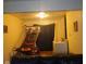Cozy view into living area with basketball game and laundry room in rear at 8256 Meadowlark Dr, Indianapolis, IN 46226
