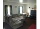 Open living room features a large sectional couch and natural light from the window at 8256 Meadowlark Dr, Indianapolis, IN 46226