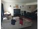 Living room with sectional couch, speakers, and tv at 8256 Meadowlark Dr, Indianapolis, IN 46226