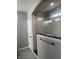 Modern bathroom features a glass-enclosed shower with white subway tile and a gray tiled floor at 9215 Hawley Dr, Indianapolis, IN 46216