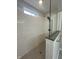 Modern bathroom features a glass-enclosed shower with white subway tile and a gray tiled floor at 9215 Hawley Dr, Indianapolis, IN 46216