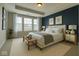 Cozy main bedroom featuring neutral decor, large windows, and ample natural light at 9215 Hawley Dr, Indianapolis, IN 46216