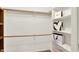 Walk-in closet features built-in shelving and ample storage space for clothing and accessories at 9578 Cadbury Cir, Indianapolis, IN 46260
