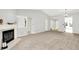 Spacious living room with a fireplace, neutral colors, and ample natural light at 9578 Cadbury Cir, Indianapolis, IN 46260