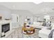 Bright living room with a fireplace and neutral décor, creating a relaxing atmosphere at 9578 Cadbury Cir, Indianapolis, IN 46260